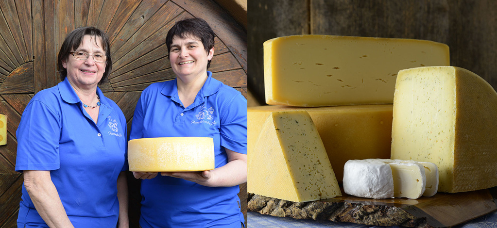 KI generiert: Zwei Personen präsentieren Käse; daneben mehrere Käsearten auf Holzplatte.