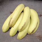 Ein runder Ausschnitt, der einen Bund gelb-grüner Bananen zeigt, mit der Beschriftung 'Bananen'.