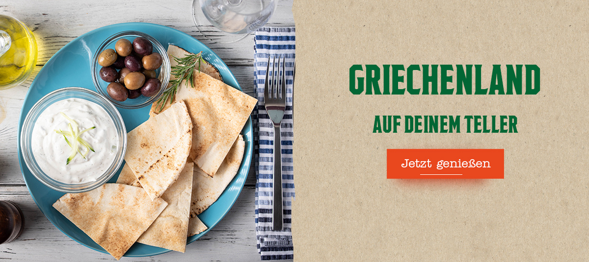 KI generiert: Ein Teller mit Fladenbrot, Oliven, Dip; daneben Text: "GRIECHENLAND AUF DEINEM TELLER. Jetzt genießen".
