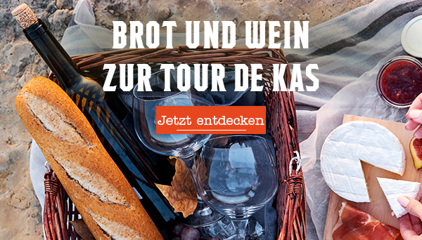 KI-generierte Beschreibung: Hauptinhalt: Brot und Wein zur Tour de Kas. Text: "BROT UND WEIN ZUR TOUR DE KAS Jetzt entdecken".